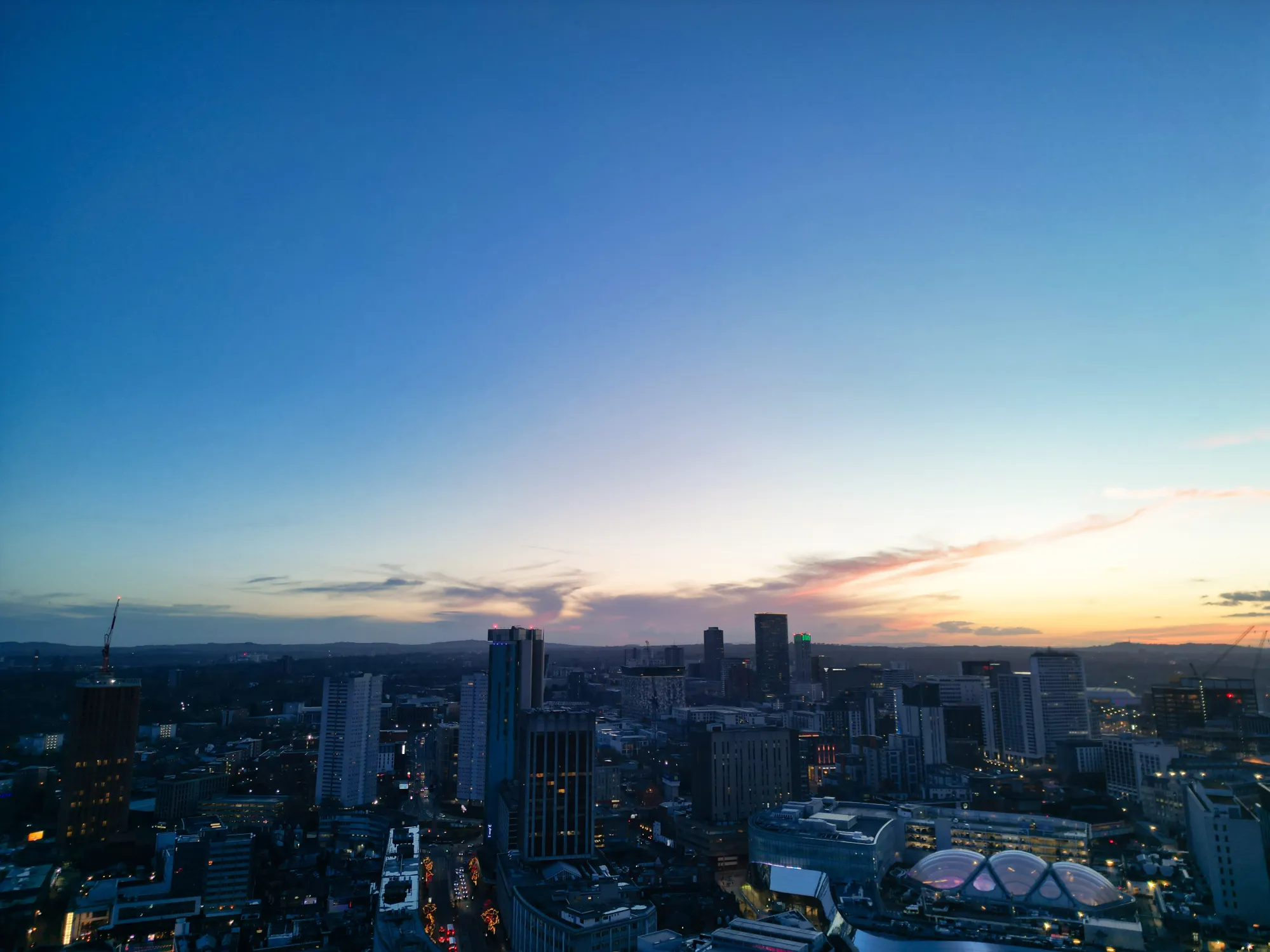 Panoramic view of Birmingham city skyline with modern buildings and urban landscape