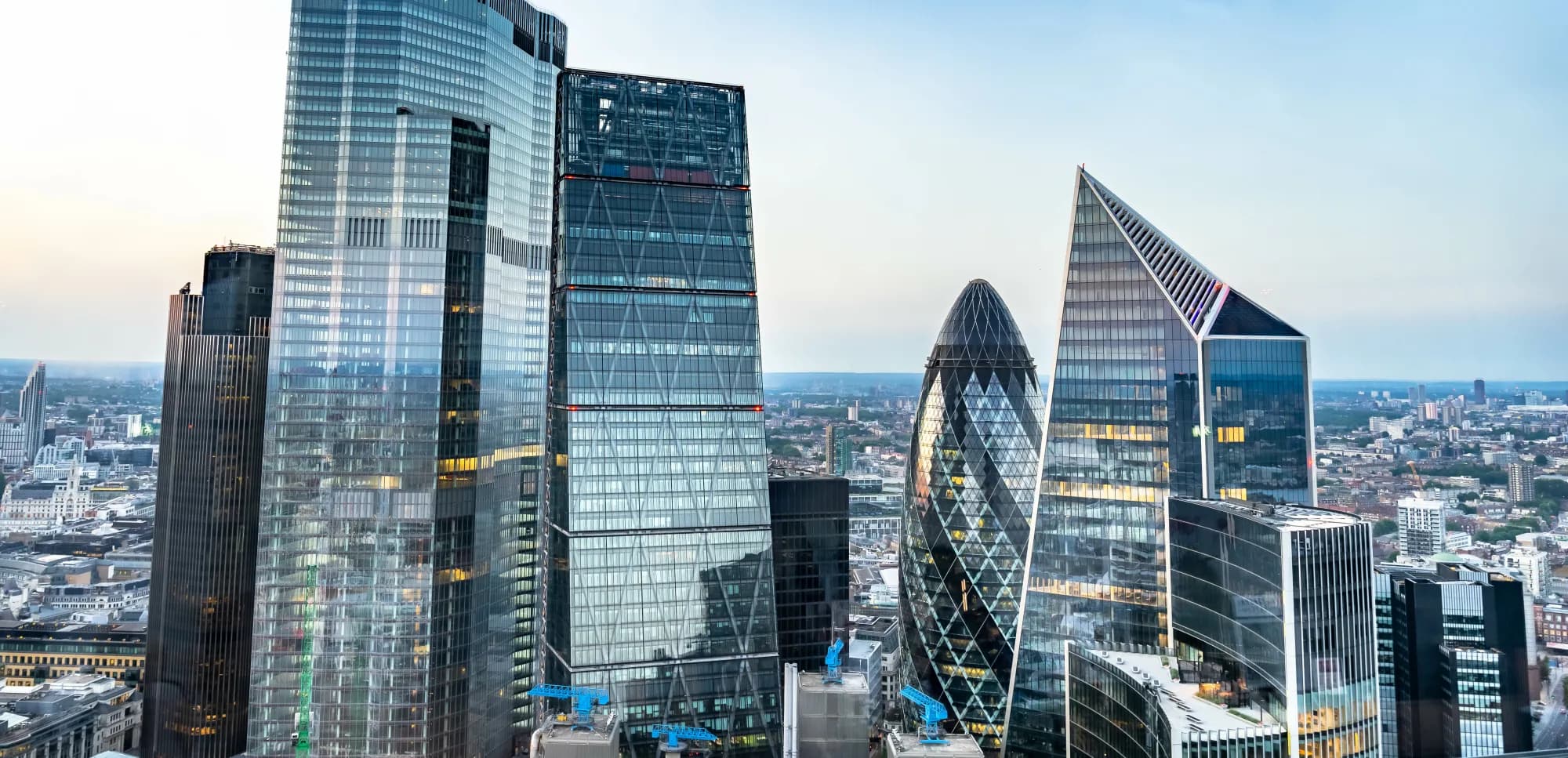 Panoramic London city skyline with the Thames and iconic skyscrapers like The Shard and other modern buildings